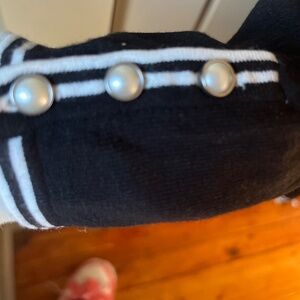 Talbots knit shirt with square neckline and pearl buttons on sleeves